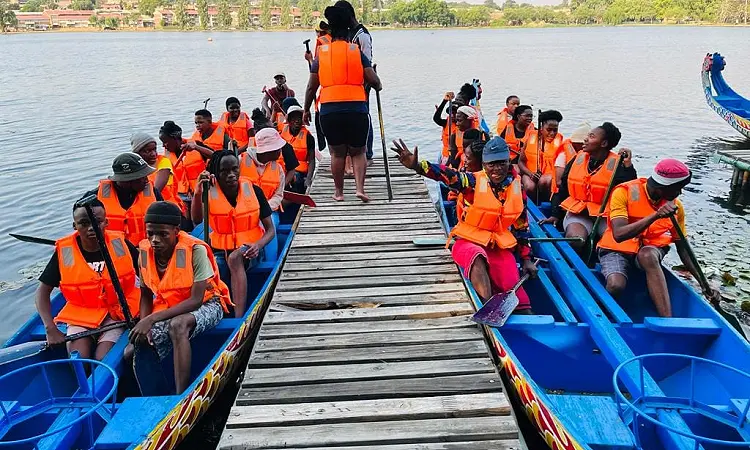Gauteng Dragon Boat Association. 2 dragon boats getting ready to depart.