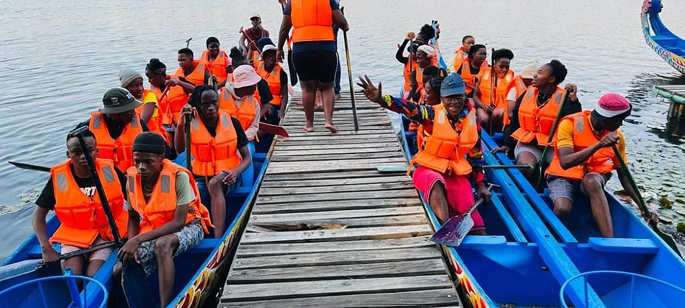 Gauteng Dragon Boat Association. 2 dragon boats getting ready to depart.